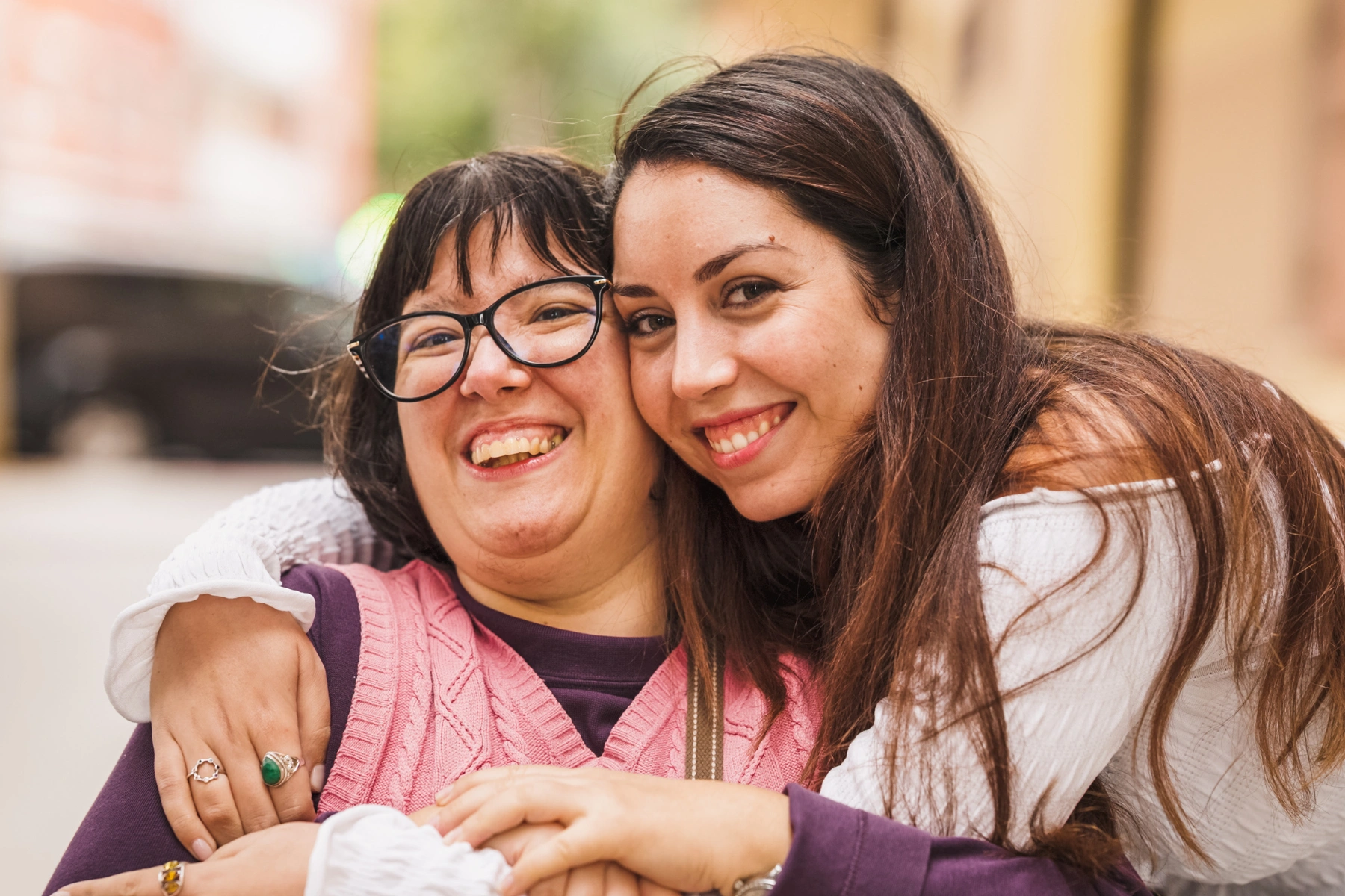 Women with disability embracing, showing inclusion and support